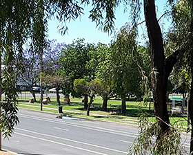Park over the road, with trees and seating