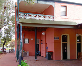 Back corner of Bourke Apartments with path to road and verandah